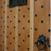 Helmsley oak door with hand forged rosehead nails and iron grille
