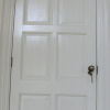 Internal painted raised and fielded panel door with bronze ironmongery