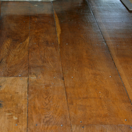 Random board flooring with traditional nail heads