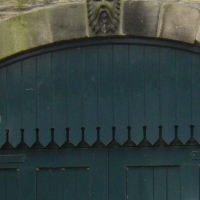 Painted garage doors in mason’s archway