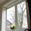 Window with field and raised panelled shuttering